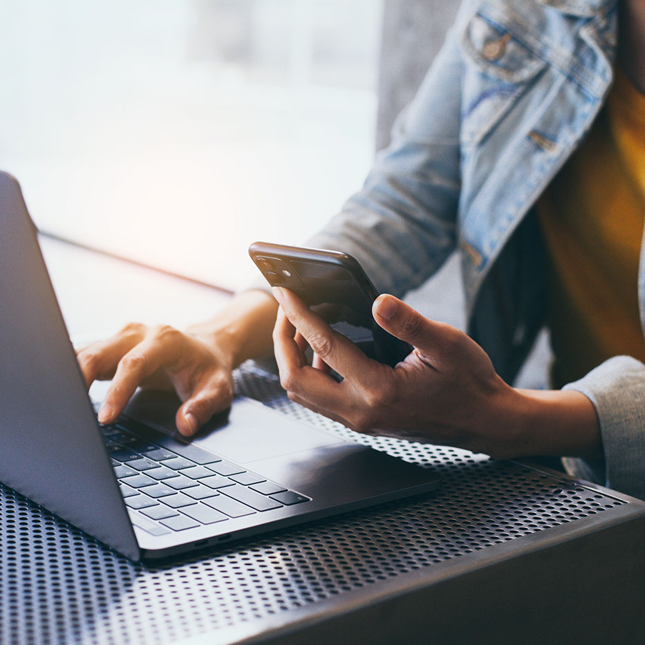 Person typing on a laptop.